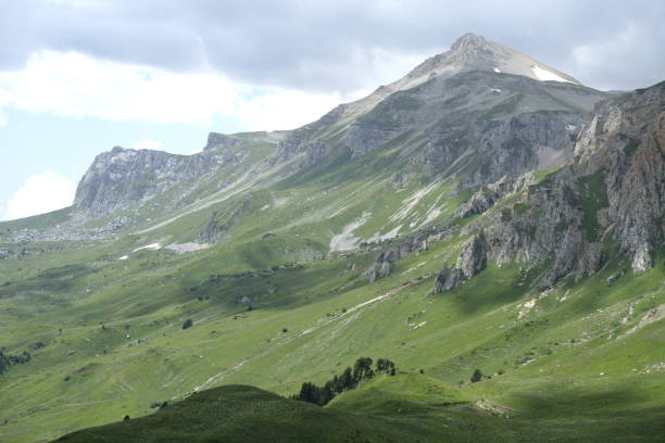 istock Mountain landscape with green valleys. 1353109481