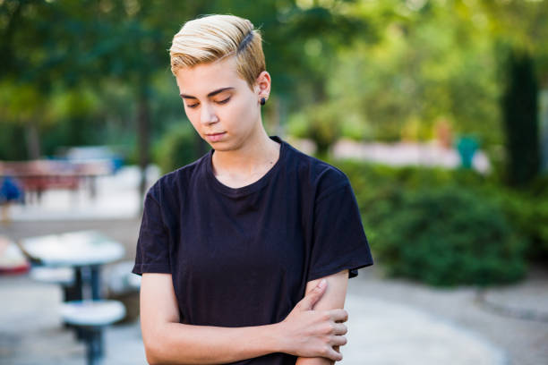 Tomboy androgynous lesbian non binary beauty in casual clothes gender lgtbi sex education. Sexual identity lesbian, homosexuality stock photo