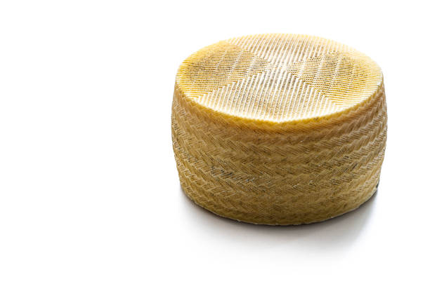 Dairy products - milk, cheese, cottage cheese on the background of cows in the barn
