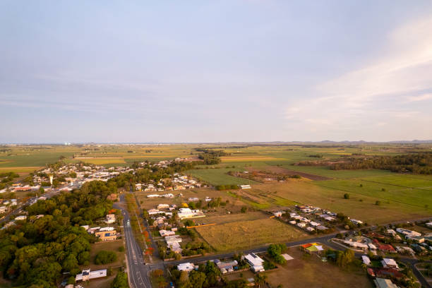 Beautiful orange light on the landscape as the sun sets over a country town