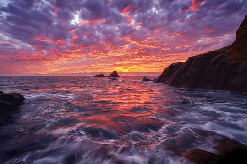 The skies above Seal Rock burned with tongues of flame and the cauldron brewed near Crescent Bay in Laguna Beach, off the southern California coast.