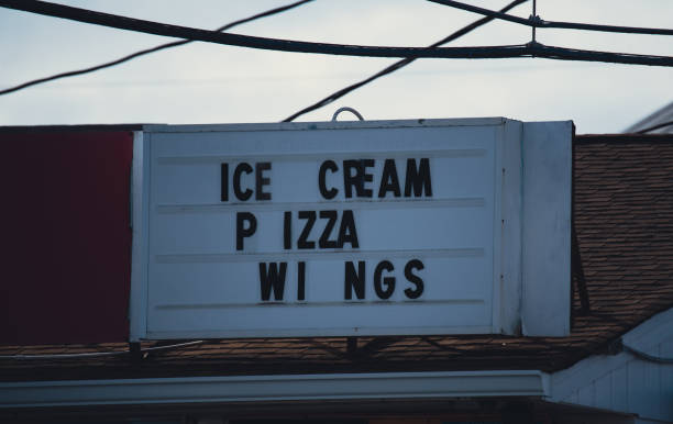 istock Ice Cream Pizza Wings Sign 1353122364