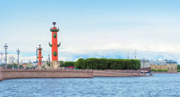 Rostral columns at Vasilievsky island, St Petersburg, Russia. View of Vasilievsky island from Neva River