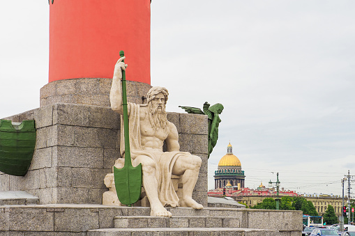 Rostral column, sculpture. Statue of a sitting elder, representing the Volkhov river. Saint Petersburg, Russia