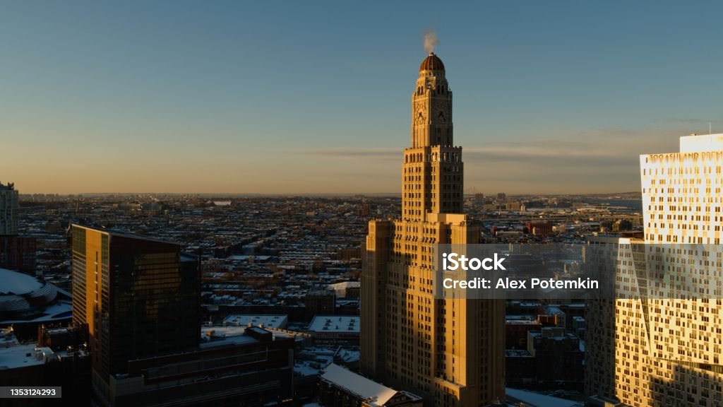 Aerial view on the One Hanson Place in Downtown Brooklyn, New York City, in the winter morning, with the residential area behind. Aerial view on the One Hanson Place in Downtown Brooklyn, NYC. Brooklyn Clock Tower Stock Photo