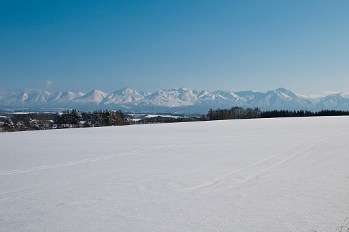 Snow fields and snow mountains with a blue sky