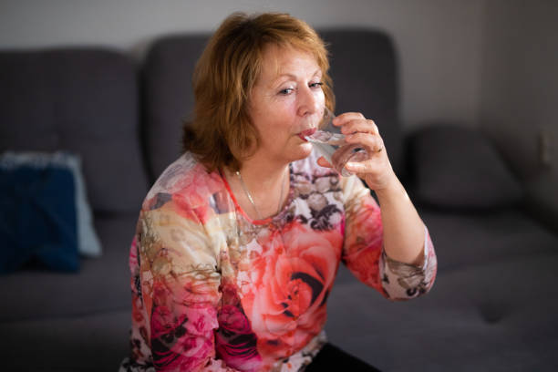 istock Senior women drinking water 1353131157