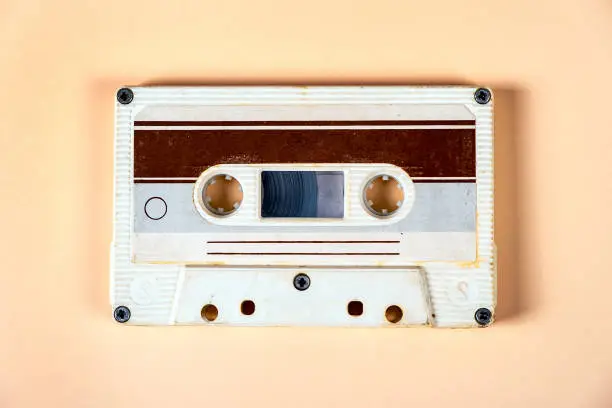 Old Audio Cassettes on the Paper Background closeup