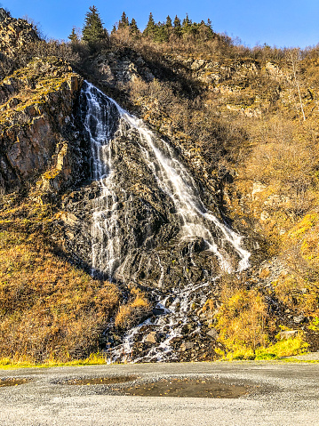 The beauty of Alaska can be seen in its various landscape features.  Traveling down the Richardson highway, in Interior Alaska, on will enter the Keystone Canyon.   The Keystone Canyon with its tall rocky cliffs also displays several waterfalls.  In the Autumn season these falls may slow down as they start to freeze. However, their beauty to impress visitors does not diminish.