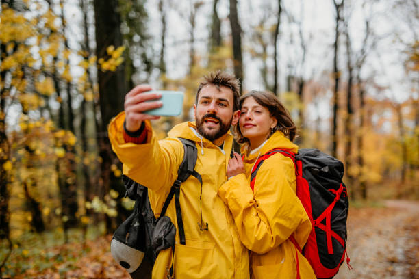 istock Cheerful couple taking a selfie 1353162530