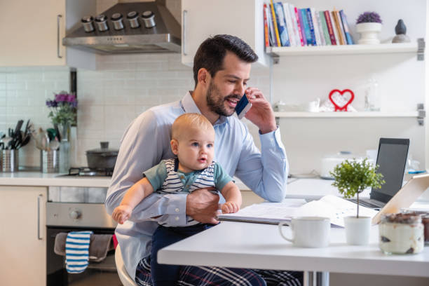istock working at home dad and her cute toddler 1353163355