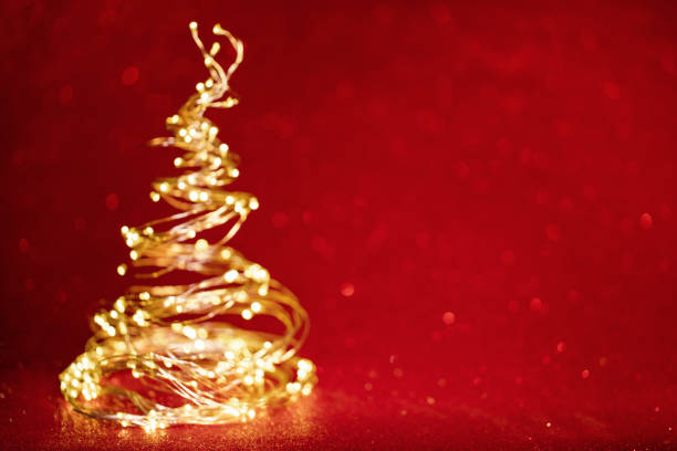 istock christmas tree from the xmas lights on red background 1353163633