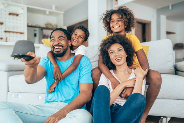 istock Family watching television 1353163717