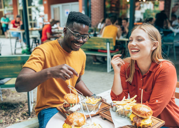 friends and fast food - burger hamburger food fast food imagens e fotografias de stock