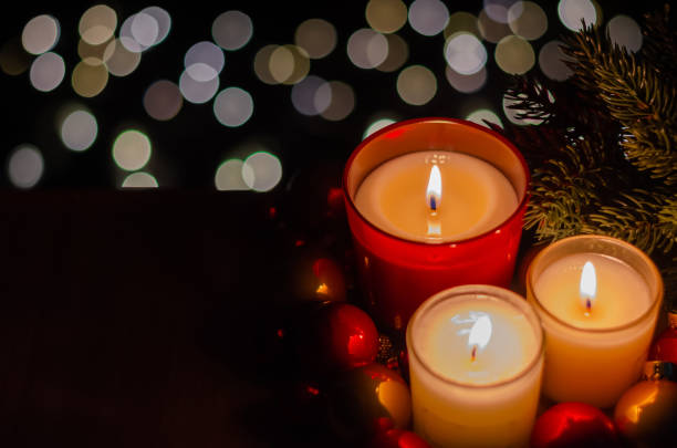 istock Burning candles with Christmas tree and bauble ornaments 1353164399