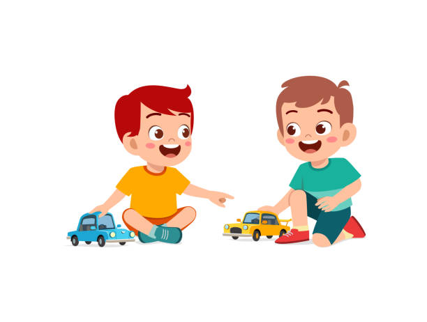 istock little boy play with small toy car with friend 1353164489