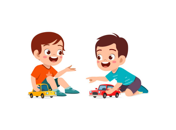istock little boy play with small toy car with friend 1353164491