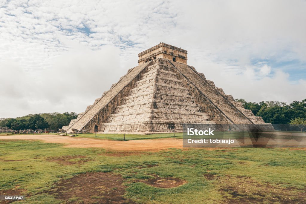 El Castillo (Kukulcán Temple) of Chichen Itza a sunny day The most famous pyramid of Yucatan and an iconic symbol of Mexico. The temple Kukulcán originates from the times of the Maya and Aztec civilisation. Caribbean Culture Stock Photo