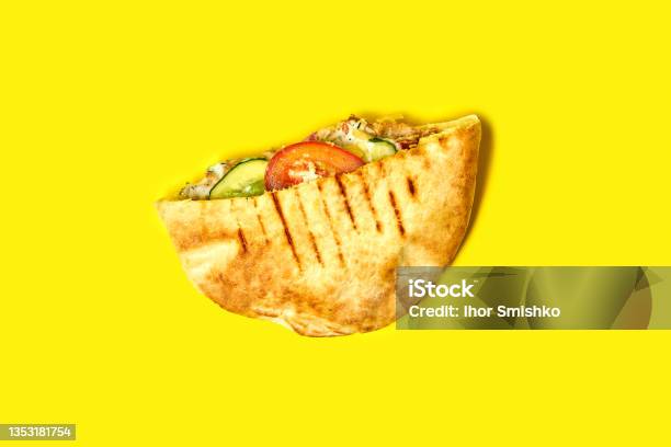 Top View Of Pita With Chicken And Vegetables On A Yellow Background Shawarma With Chicken Stock Photo - Download Image Now