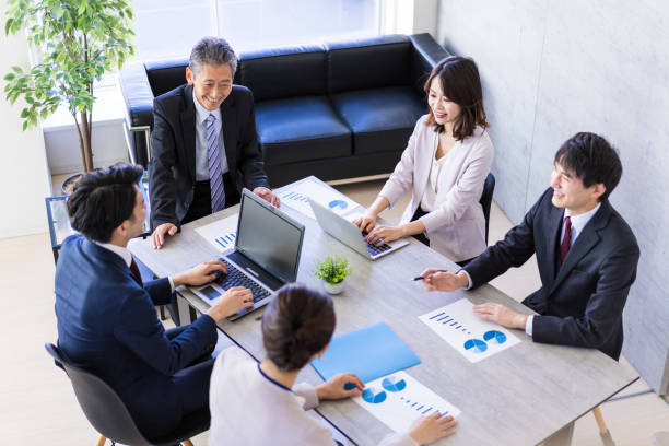 istock Business persons working in an office 1353187137