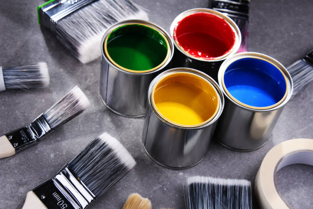 istock Paintbrushes of different size and paint cans 1353189476