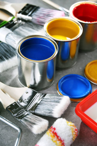 istock Paintbrushes of different size and paint cans 1353189488