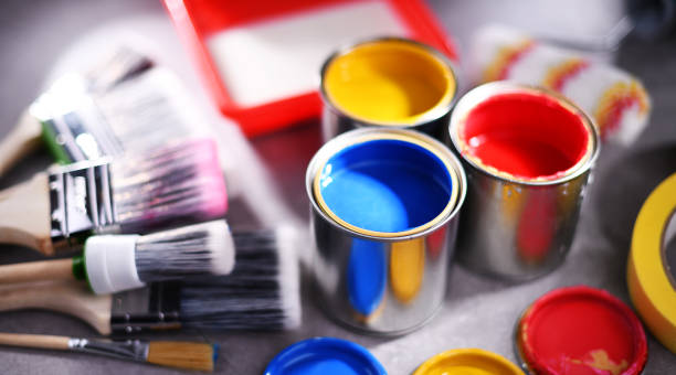 istock Paintbrushes of different size and paint cans 1353189503