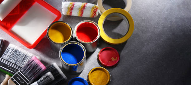 istock Paintbrushes of different size and paint cans 1353189508