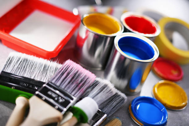 istock Paintbrushes of different size and paint cans 1353189530