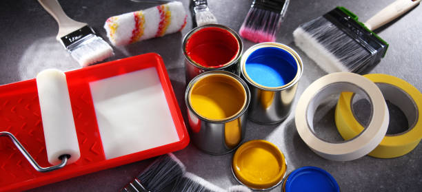 istock Paintbrushes of different size and paint cans 1353189559