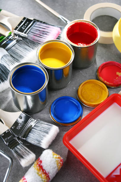 istock Paintbrushes of different size and paint cans 1353189592