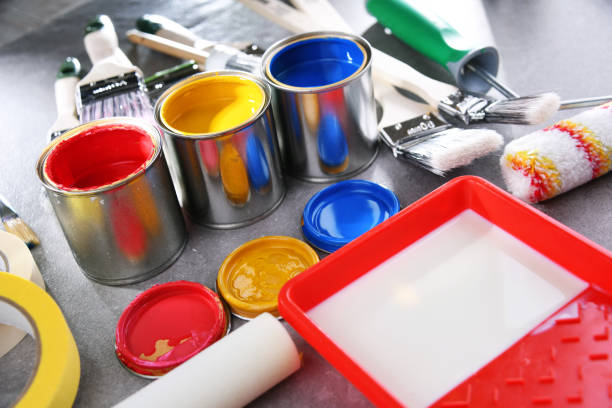 istock Paintbrushes of different size and paint cans 1353189604