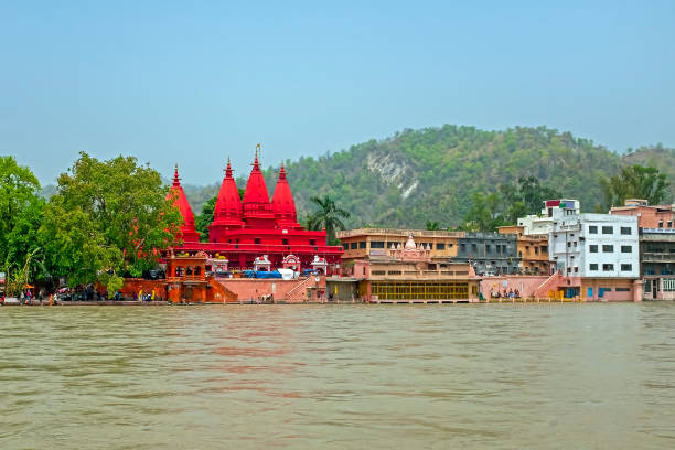 View on Hardwar with a red temple at the river Ganga in India Asia stock photo