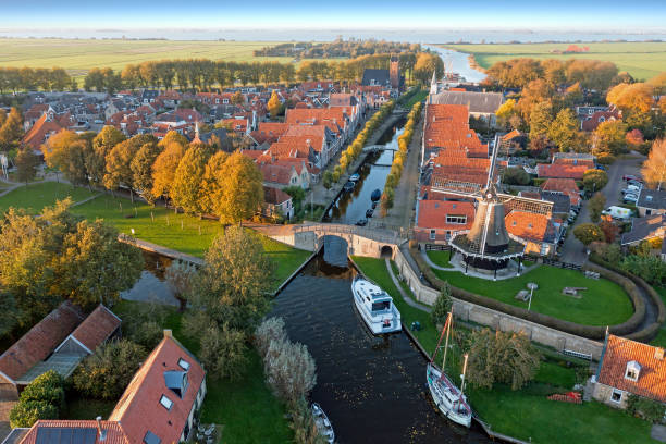 Aerial from the historical village Sloten in Friesland the Netherlands in fall Aerial from the historical village Sloten in Friesland the Netherlands in fall friesland netherlands stock pictures, royalty-free photos & images