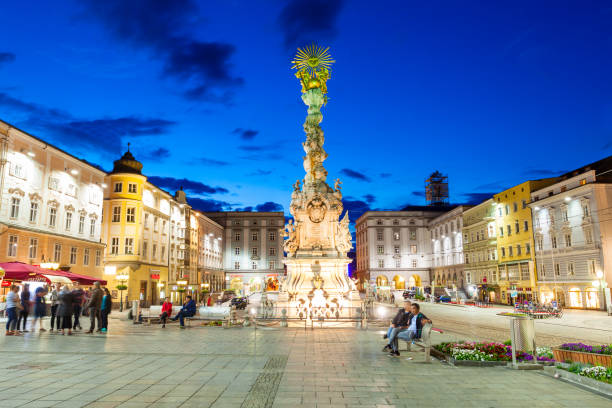 Hauptplatz main square, Linz LINZ, AUSTRIA - MAY 14, 2017: Holy Trinity column on the Hauptplatz or main square in the centre of Linz in Austria at sunset. Linz is the third largest city of Austria. linz austria stock pictures, royalty-free photos & images