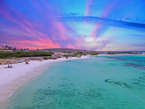 Aerial from Baby beach on Aruba island in the Caribbean Sea at sunset stock photo