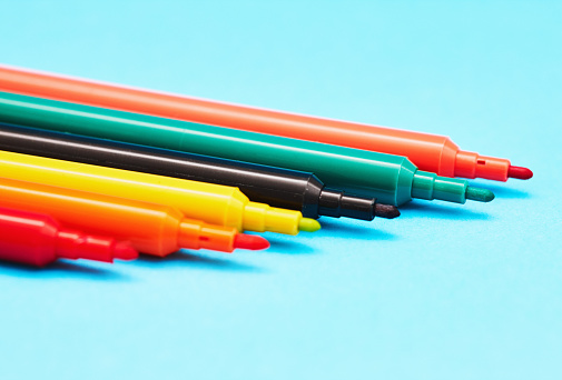 Spectrum of colors in a group of brightly colored felt-tipped pens, with copy space.