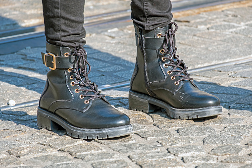 istock Female with black boots and black jeans 1353193278