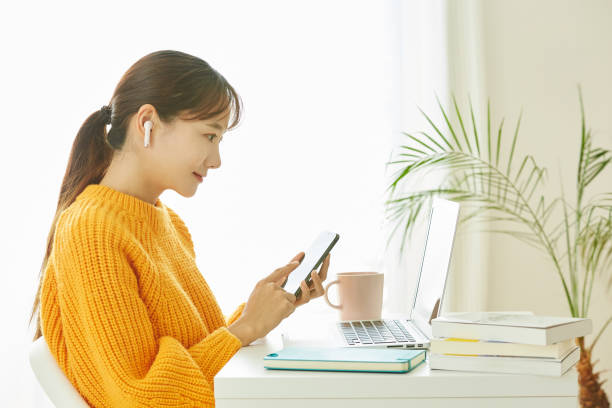 istock A young Asian woman working at home 1353193644