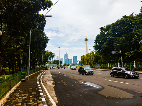 Central Jakarta, Indonesia - April 5th, 2021: Medan Merdeka Utara Street is a road that is close to the Indonesian National Monument or Monas in the city of Central Jakarta.