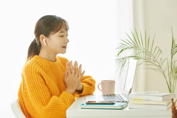 istock A young Asian woman working at home 1353195907