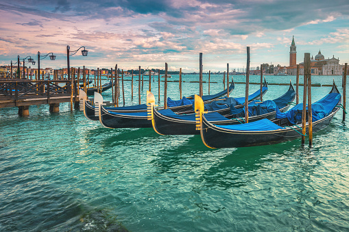 Beautiful view with anchored gondolas on the Grand Canal, Venice