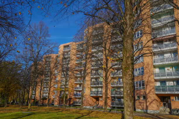 residential house blocks in autumn with trees and leaves - plattenbau homes architectural detail architecture and buildings imagens e fotografias de stock