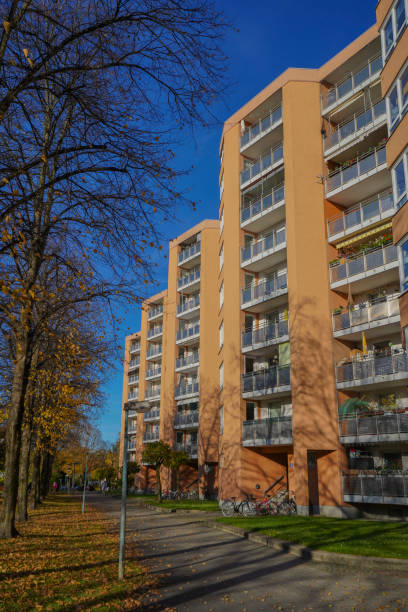 residential house blocks in autumn with trees and leaves - plattenbau homes architectural detail architecture and buildings imagens e fotografias de stock