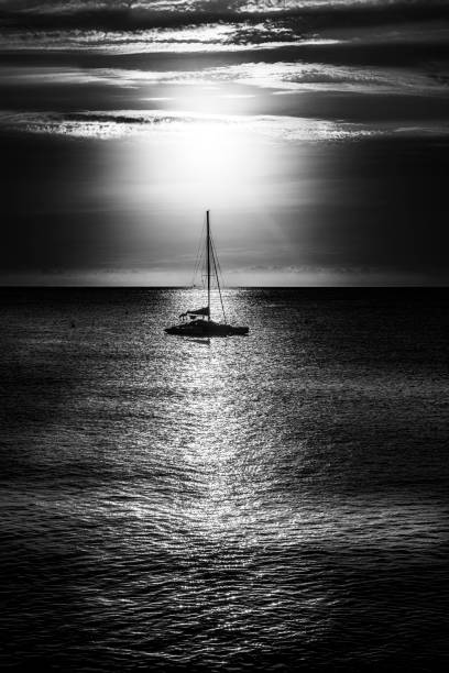 Caught the Boat in line with the rising sun and converted the image into Black and white.