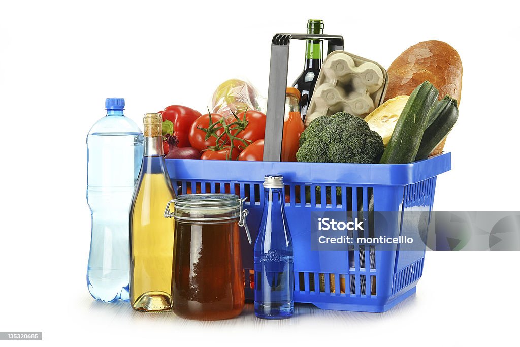 Composition with groceries in shopping basket isolated on white Shopping Basket Stock Photo
