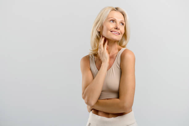 istock Beautiful middle-aged isolated on grey background 1353206892