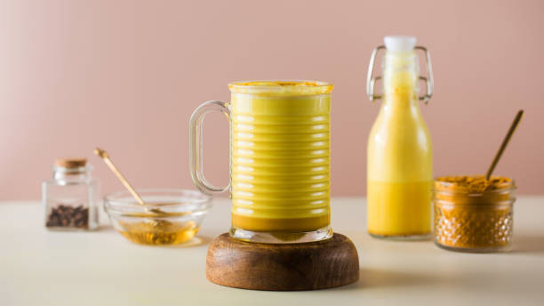 istock Latte turmeric on a pink background. Moon milk for better sleep. Copy space. 1353207995
