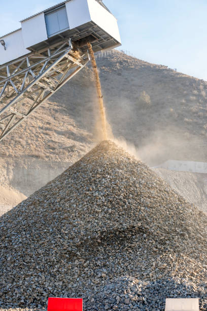 istock Mining belt conveyor is moving mines from breaker. Conveyors are durable and reliable components used in automated distribution and warehousing, as well as manufacturing and production facilities. 1353208028