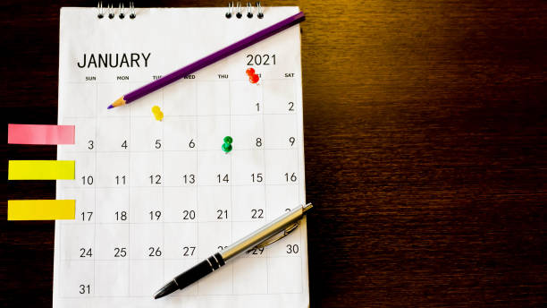 istock Close up the calendar on the brown table in planning ideas. 1353209380